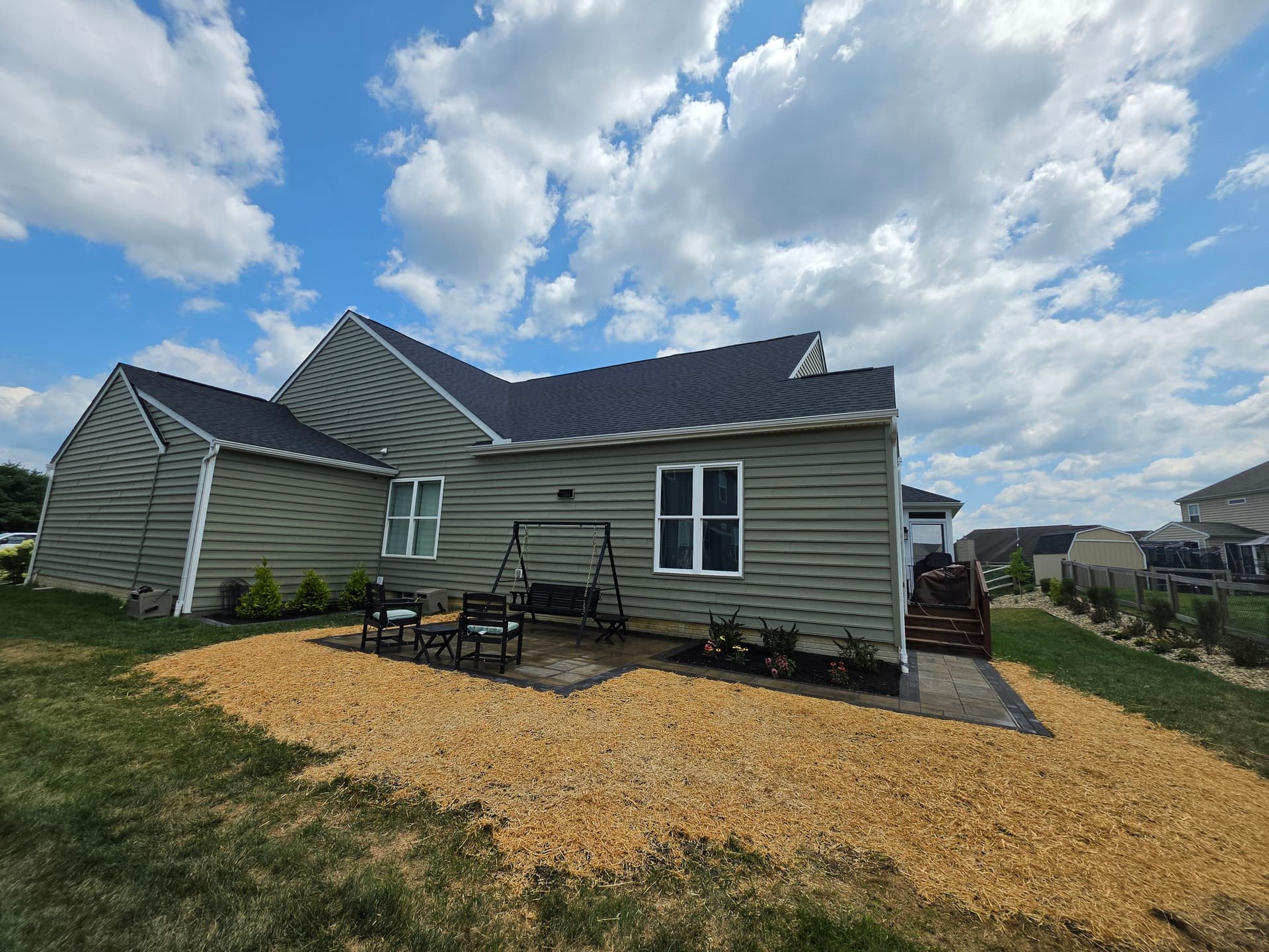 Custom Patio, River Rock Beds, and Fresh Plantings Done Right