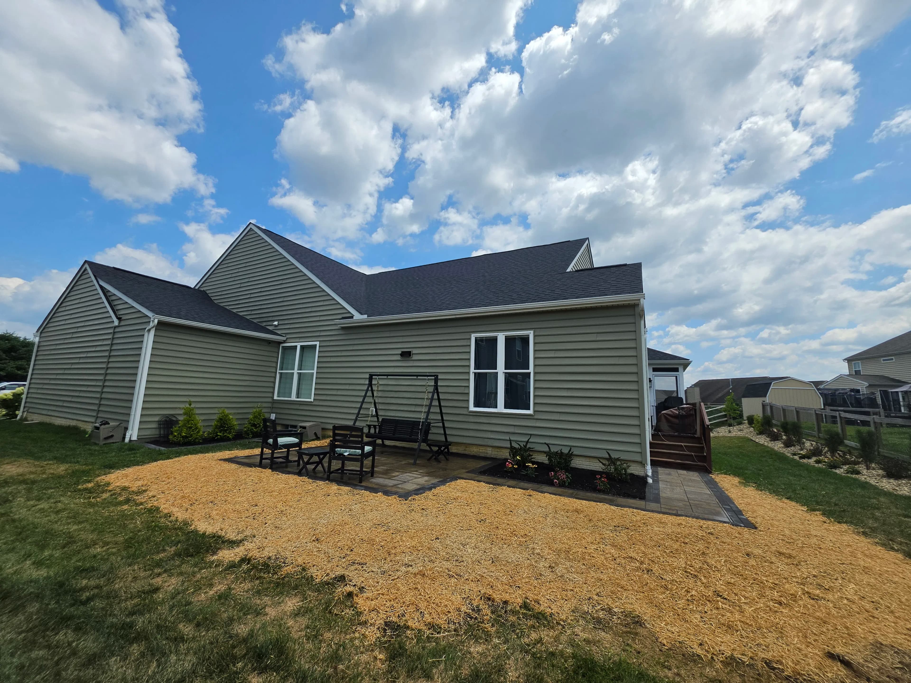 Project Custom Patio, River Rock Beds, and Fresh Plantings Done Right image
