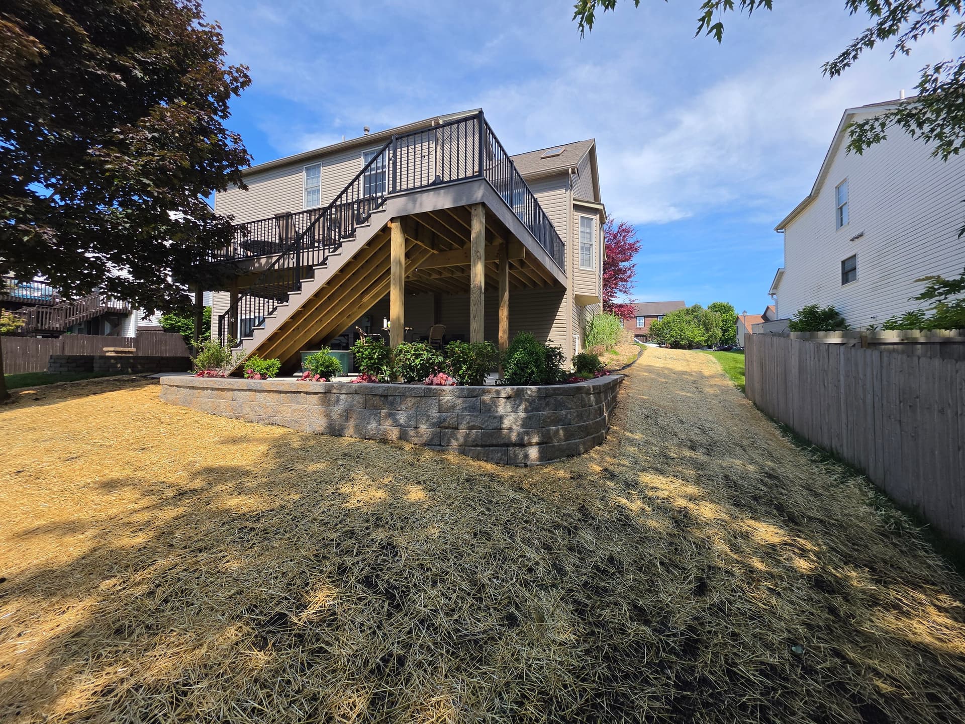 Retaining Wall, Planting Bed and Full Yard Restoration Completed