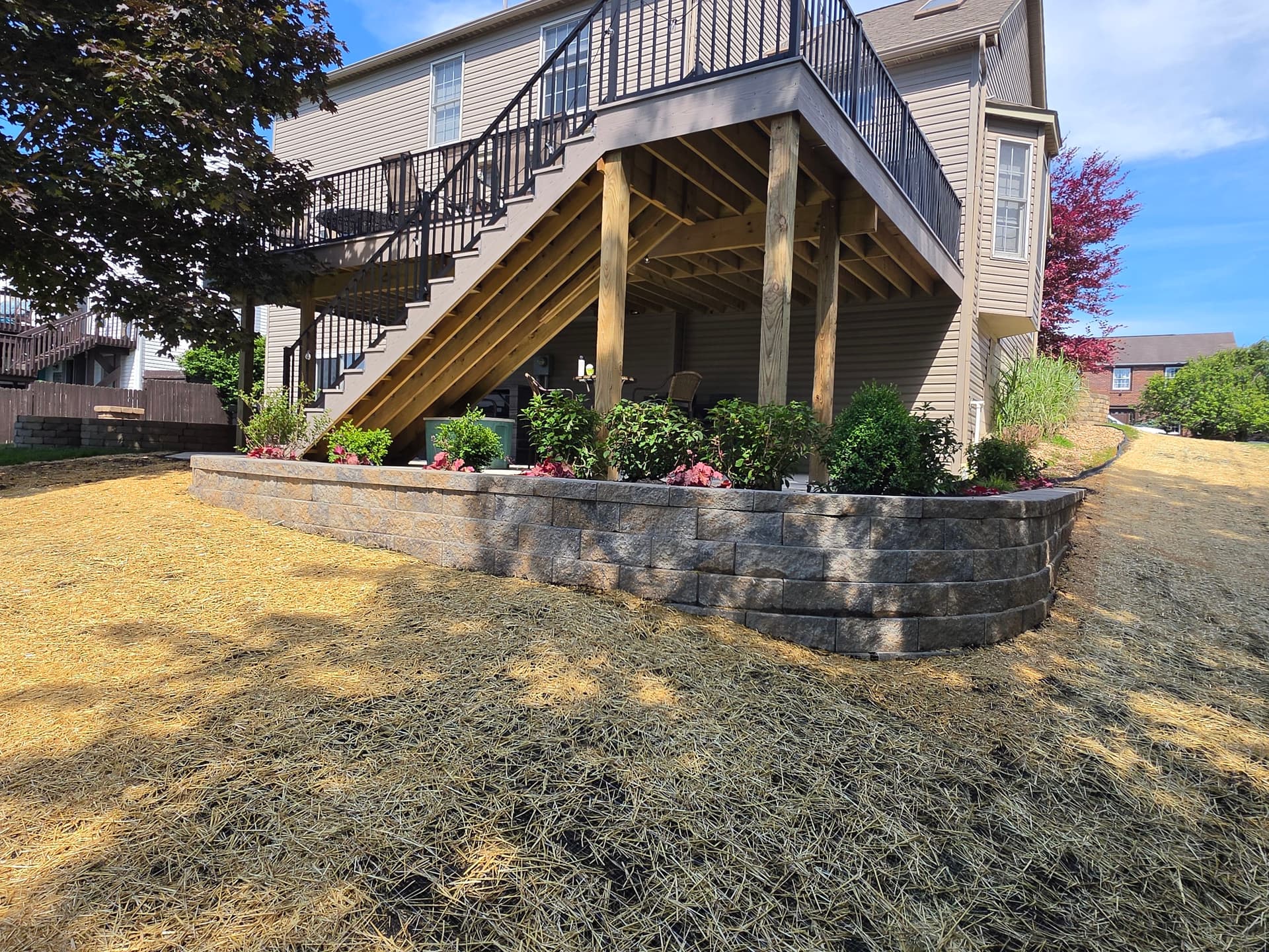 Retaining Wall, Planting Bed and Full Yard Restoration Completed