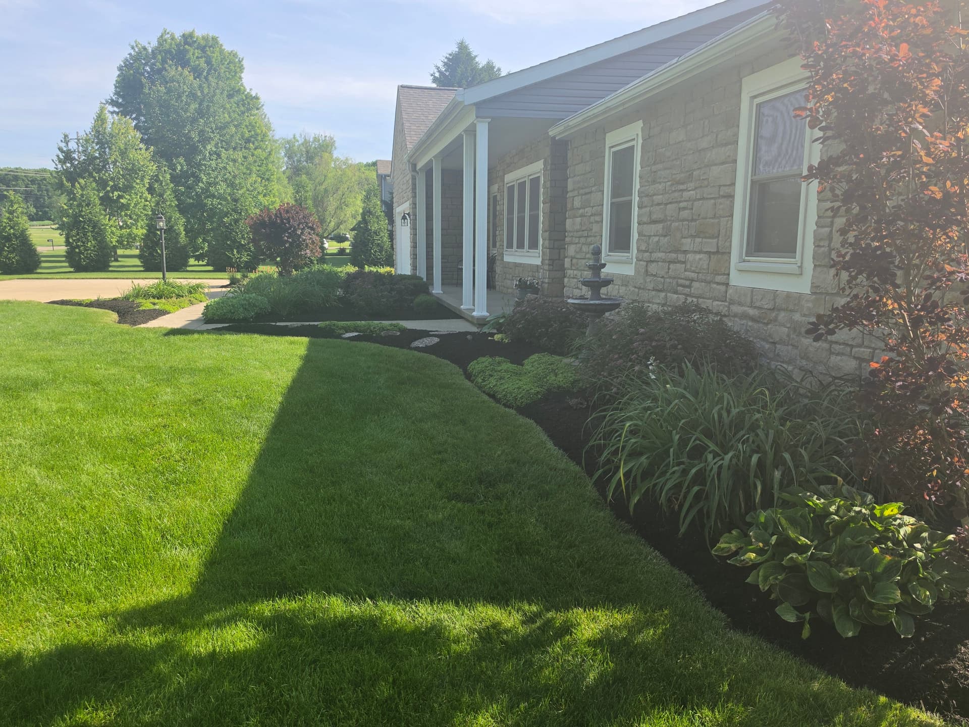 Gallery photos for Fresh Mulch and Clean Beds Keep This Landscape Looking Sharp: Image #6
